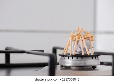 A Small Bonfire Without A Fire On A Kitchen Stove Depicts Rising Gas Prices.