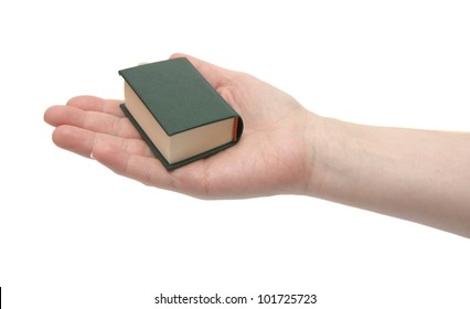 The Small Book In A Hand On A White Background.