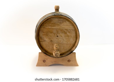 A Small Bourbon Barrel On A White Background. Corn Whiskey Is Aged For Varying Lengths Of Time In An Oak Barrel To Make Bourbon. Bourbon Is Usually Associated With The Southern US, Primarily Kentucky.