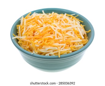 A Small Bowl Filled With Shredded White Cheddar, Sharp Cheddar And Mild Cheddar Cheeses Isolated On A White Background.