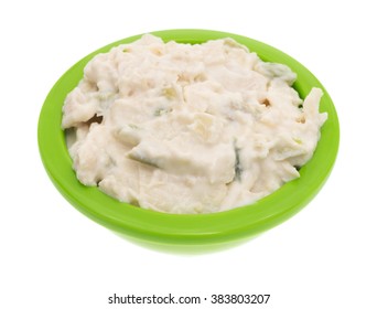 A Small Bowl With Fresh Chicken Salad Isolated On A White Background.