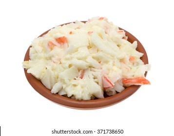 A Small Bowl With Surimi Crab Meat Made Into A Salad With Mayonnaise Isolated On A White Background.