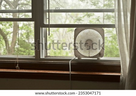 Small Box Fan in a Window