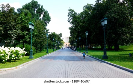 Small boy with backpack in park