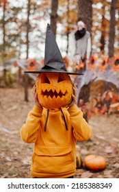 Small boy with halloween pumpkin in black witch hat. Little boy having fun, celebrating halloween concept - Shutterstock ID 2185388349