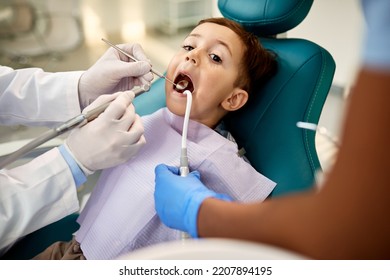 Small Boy Having Teeth Check Up At Dental Clinic.