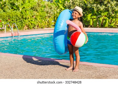 Small Boy With Inflatable Ring, Ball, Pool Noodle