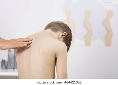 Small boy rear view during examination at a physiotherapist office