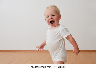 Small Boy Running Around In House