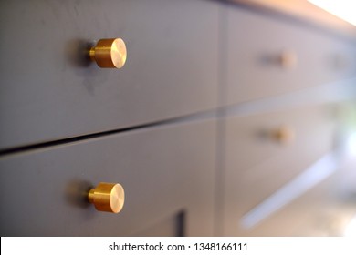 Small Brass Knobs On Grey Kitchen Drawers