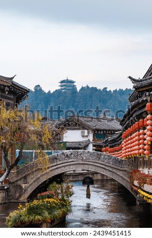 A small bridge over the flowing stream in the Old Town of Lijiang, China