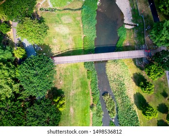 small bridge over a stream viewed from above