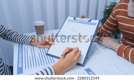 small business accounting team meeting three asian people with salary monthly charts data, basic business accounting and bookkeeping concept.