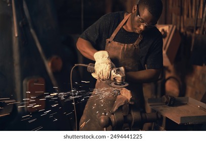 Small business, black man and blacksmith in workshop for metal work, maintenance and crafting steel. Garage, welder and craftsman with remodeling for repairs or objects for supply and welding - Powered by Shutterstock