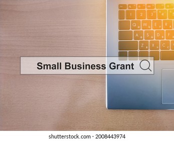 Small Business Grant - Hologram On The Background Of An Ultrabook. Investment Concept For A Startup