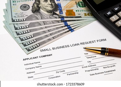 Small Business Loan Form, 100 Dollar Bills. Concept Of Financial Assistance, Stimulus Payment And Recession During Covid-19 Coronavirus Pandemic