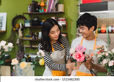 Small Business. Male And Female Florists Making Rose Bouquet In Flower Shop. Man Owner And Woman Assistant In Floral Design Studio, Making Decorations And Arrangement. Flowers Delivery, Creating Order