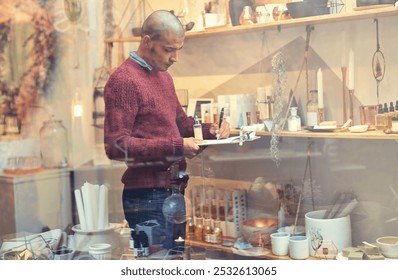 Small business, man and writing on clipboard at organic store or market for checking or counting stock. Male person, employee and assistant at ointment shop for orders, checklist and inspection - Powered by Shutterstock