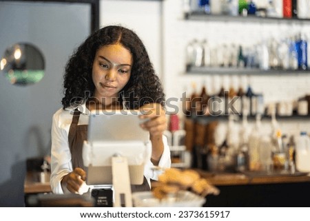 Small business owner and barista efficiently manage coffee shop's daily routine, from opening, welcoming customers to taking orders, processing payments, maintaining a tasteful, clean environment.