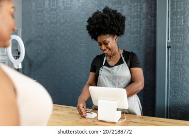 Small Business Owner At A Cash Register