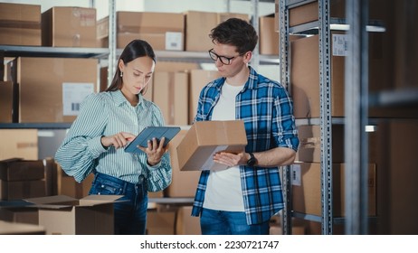 Small Business Owner and Employee Checking Stock and Inventory with Tablet Computer in Retail Warehouse full of Shelves with Goods. Working in Logistics, Online Shop Distribution Center.