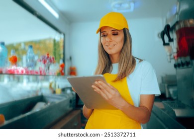 
Small Business Owner Holding Pc Tablet in her Food Tuck. Happy restaurant manager holding an electronic device for online ordering 
 - Powered by Shutterstock