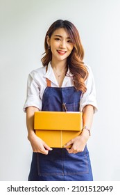 Small Business Owner Looking At Company's Past Online Sales, Cropped Image Of Woman Holding Her Own Box For Delivery At Online Sales Office, Merchandising Concept And Modern Businessman.