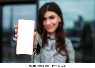 Small Business Owner Office Worker Woman Standing Outside Building With Mobile Phone Make Selfie Video Chat. Female Mexican Latin American Successful Executive Girl Hold Gadget Mock Up Copy Space