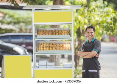 Small Business Owner Standing Proudly In Front Of His Food Stall. Entrepreneur Concept