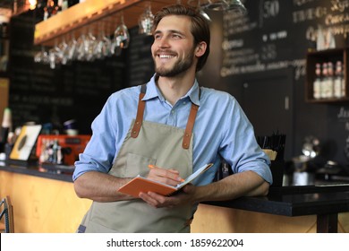 Small business owner working at his cafe.