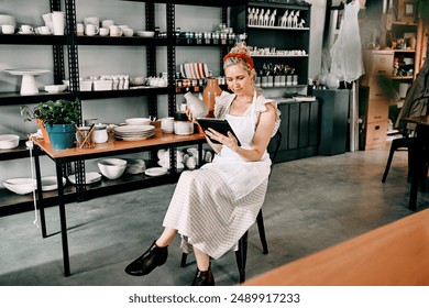 Small business, pottery or woman with tablet for check, item code or inventory in boutique. Female entrepreneur, startup or tech for logistics in ceramic workshop, online order or product information - Powered by Shutterstock