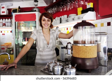 Small Business: Proud Owner Or Waitress Working At A Cafe