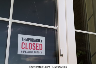 Small Business Sign On The Storefront Window Closed Because Of Coronavirus Or COVID19.