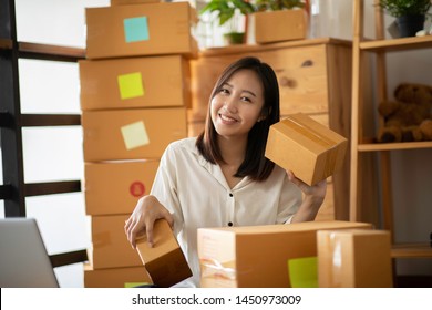 Small Business SME Entrepreneur Of Young Asian Women Working With Laptop For Online Shopping At Home,Cheerful And Happy With Box For Packaging In Home,Own Business Start Up For Business Online