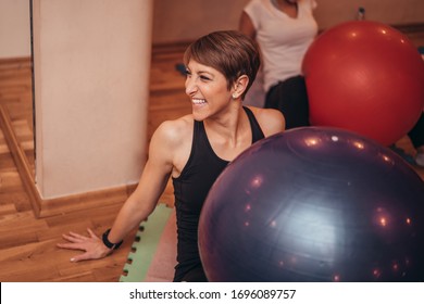 Small Business Successful Owner Of Pilates And Joya Studio Smiling Trainer Instructor Having A Class