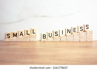 Small Business Text From Wooden Blocks. Local Investment, Merchandise, Retail And Entrepreneurship Concept