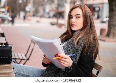 Small Busy Business Owner Elegant Pretty Woman Office Manager Freelancer Sitting Outside Street Cafe Coffee Shop Wooden Table, Signing Documents, Working With Papers. Female Entrepreneur, Copy Space
