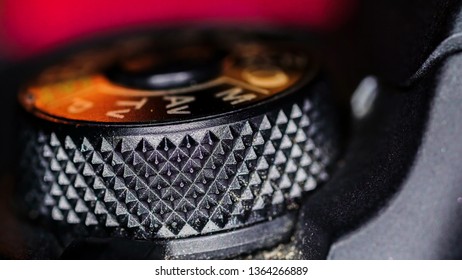 The small buttons on the top of the camera on a macro shot with the on and off button and the roller
