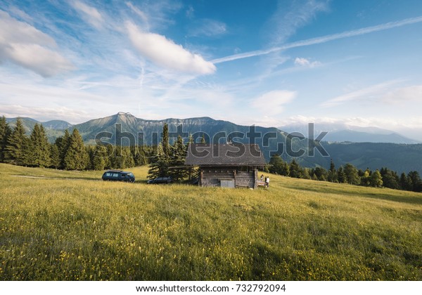 Small cabin and flowery field in the Northern\
Alps in Austria.