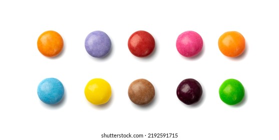 Small candies set isolated. Colorful dragees mix, multicolored glazed chocolate buttons, various dragee collection, rainbow candies on white background