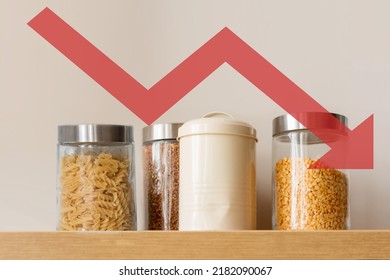 Small Cans Of Cereal On A Shelf On A White Background With Red Arrow Down. Food Crisis Concept