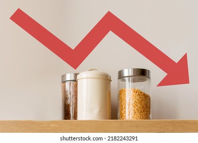 Small Cans Of Cereal On A Shelf On A White Background With Red Arrow Down. Food Crisis Concept