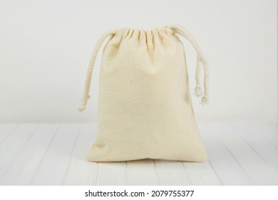 Small Canvas Sack, Muslin Drawstring Favor Or Gift Bag Mockup For Design Presentation.	
