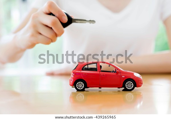 small car and key for car, car leasing and car\
loan concept