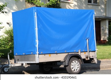 Small Car Trailer With Blue Tarp