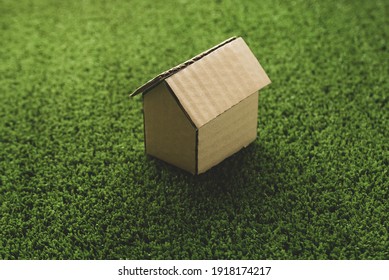 Small Cardboard House On The Grass.