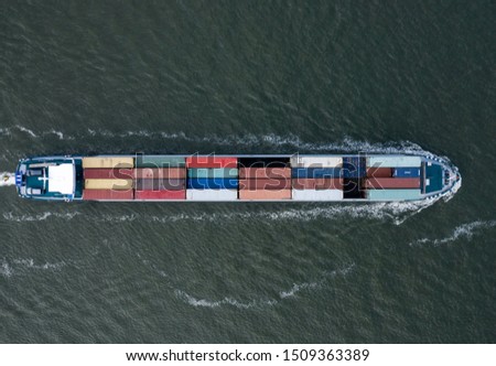A Small Cargo Ship Carrying Containers Bird's Eye View