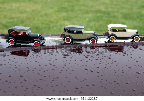 small cars on the hood of the\
car