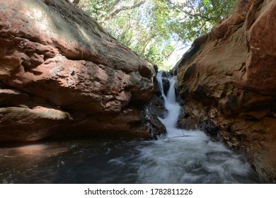 Small cascade in the river with rocks