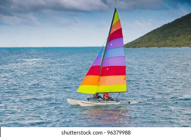 Small Catamaran Sailboat In The Caribbean